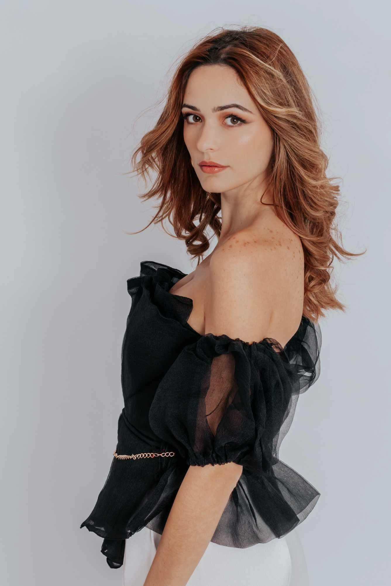 Raven Peplum Top - Akalia