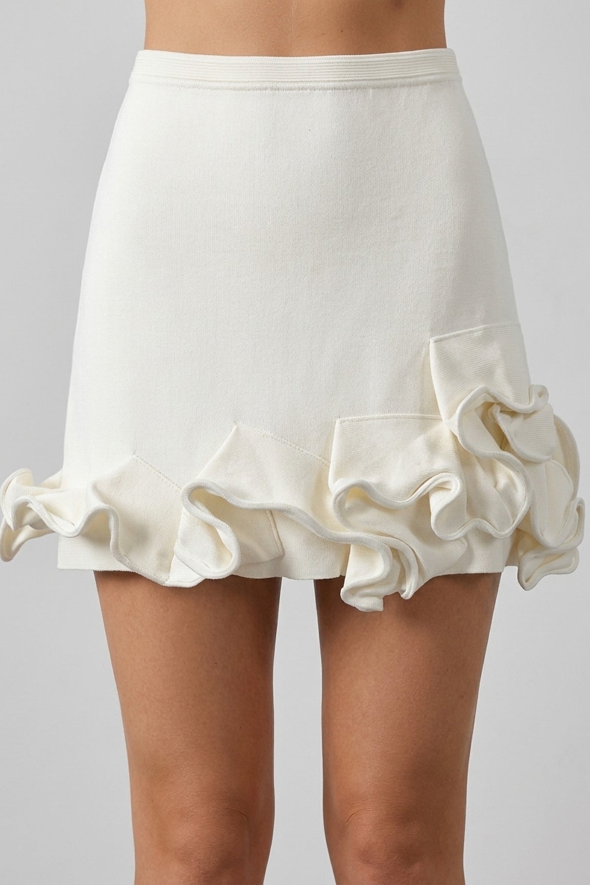 Capucine Ruffle-Trim Knit Tank and Mini Skirt Set close-up of the ruffle hem skirt - Akalia
