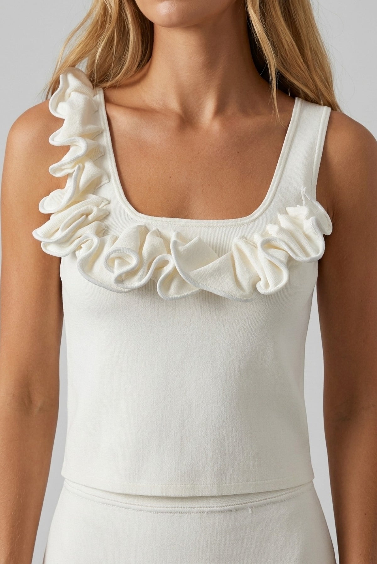 Capucine Ruffle-Trim Knit Tank and Mini Skirt Set close-up of the ruffle neckline - Akalia