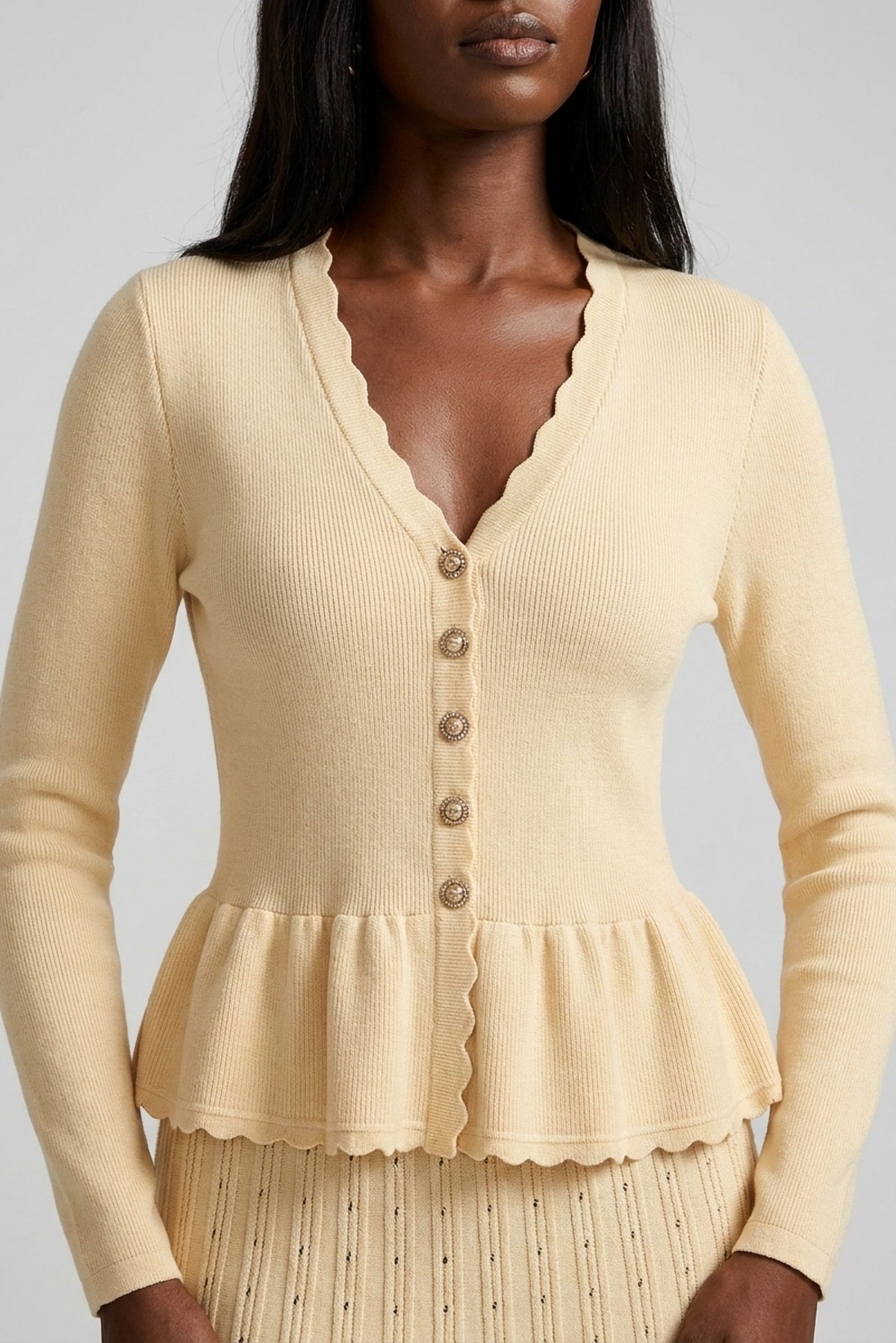 Henriette Knit Peplum Cardigan and Pleated Skirt Set close-up of the peplum cardigan - Akalia