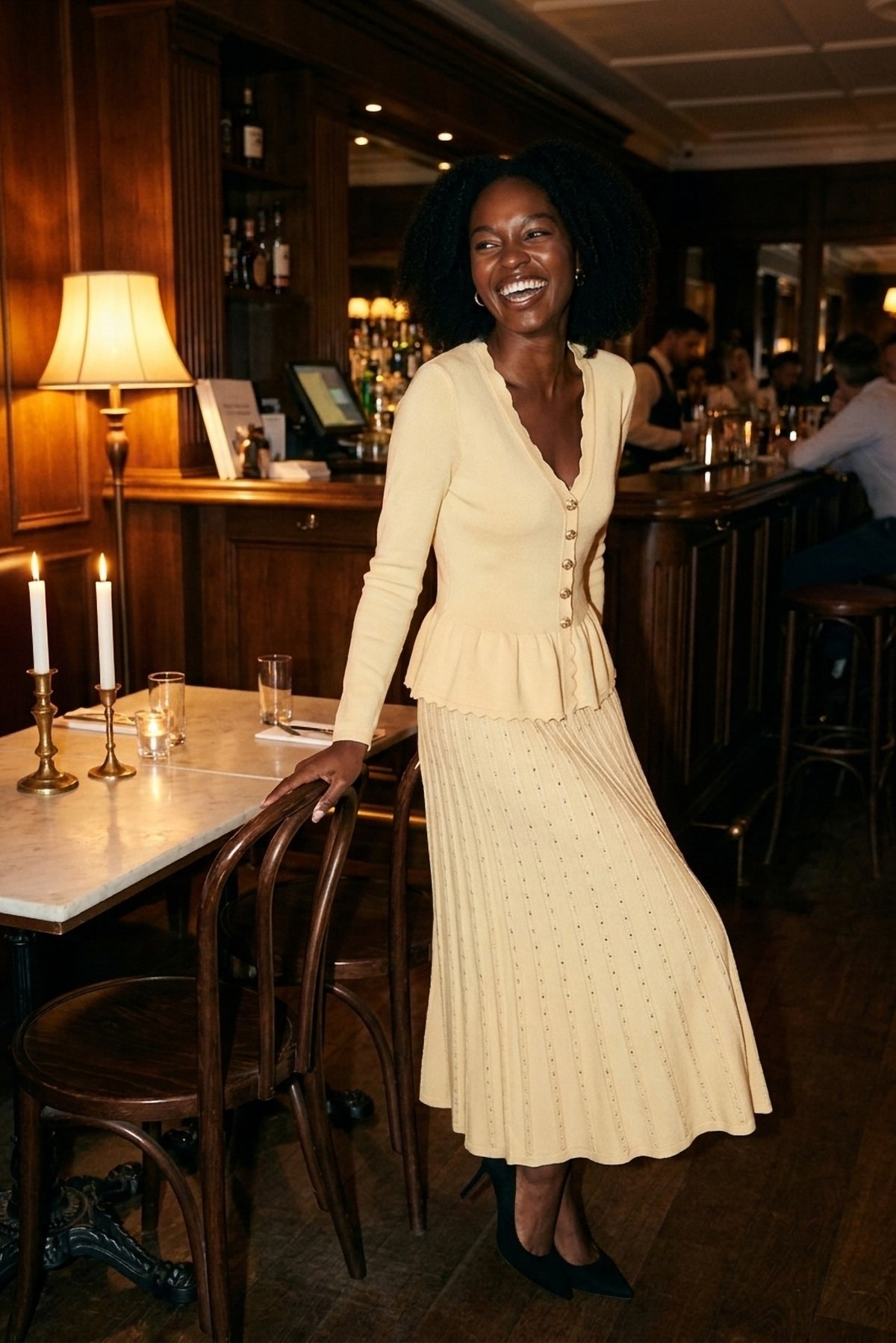 Henriette Knit Peplum Cardigan and Pleated Skirt Set worn by candlelight - The Candlelight Edit - Akalia